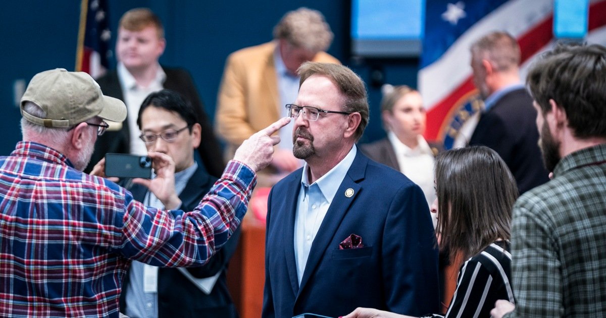 Republican congressman faces extended boos and jeers at rowdy town hall