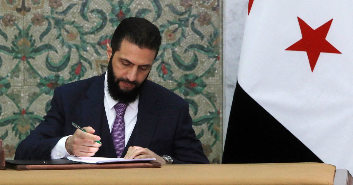 Syria’s new leader signs constitution to keep his Islamist group in power for five years