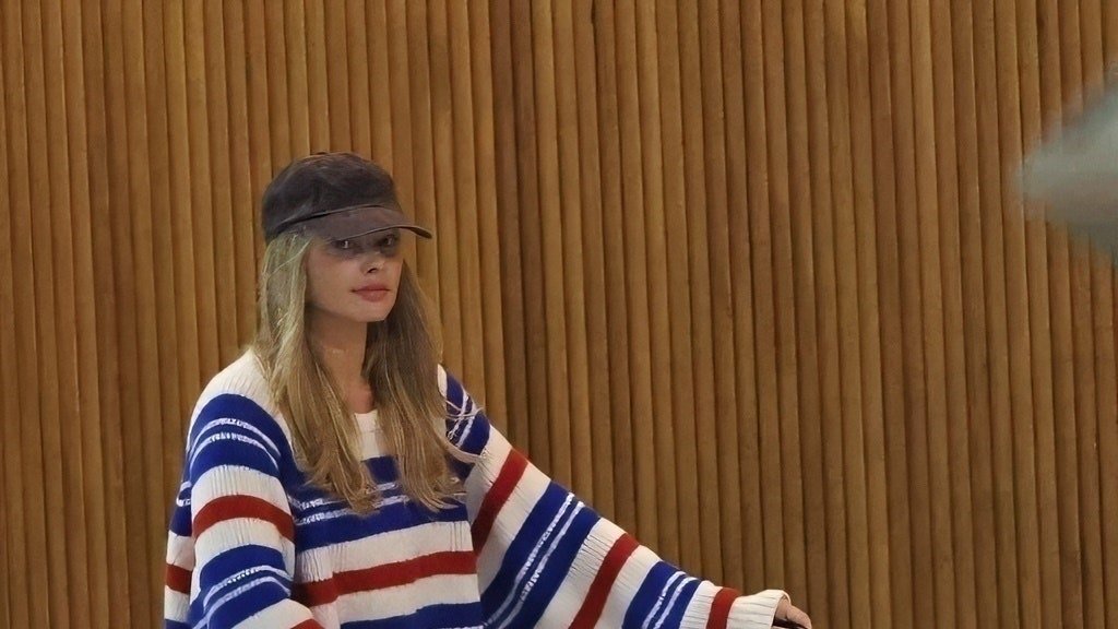 Margot Robbie—and Her Newborn—Travel in Style