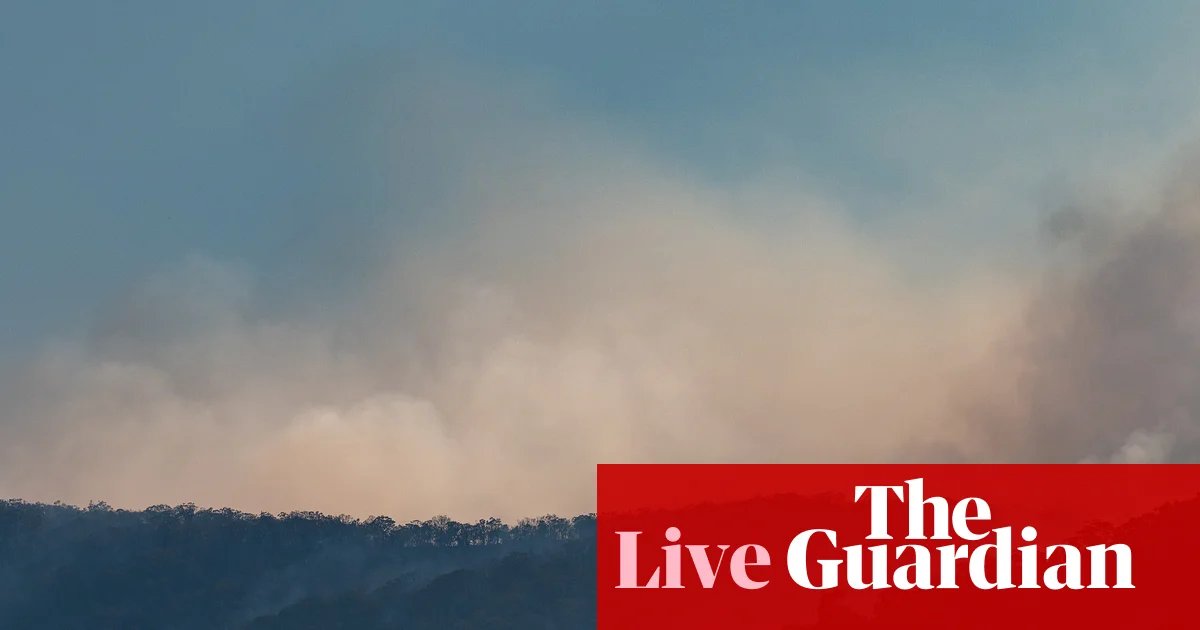 Australia news live: disaster assistance announced for NSW bushfire victims after up to 16 homes destroyed | Australia news