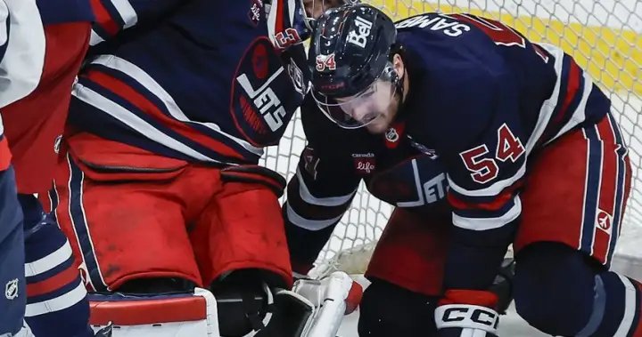 Hellebuyck all smiles in return from knee surgery