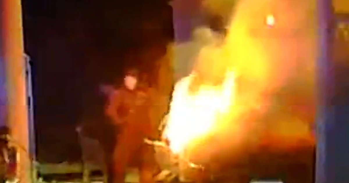 Officers rescue driver from burning vehicle