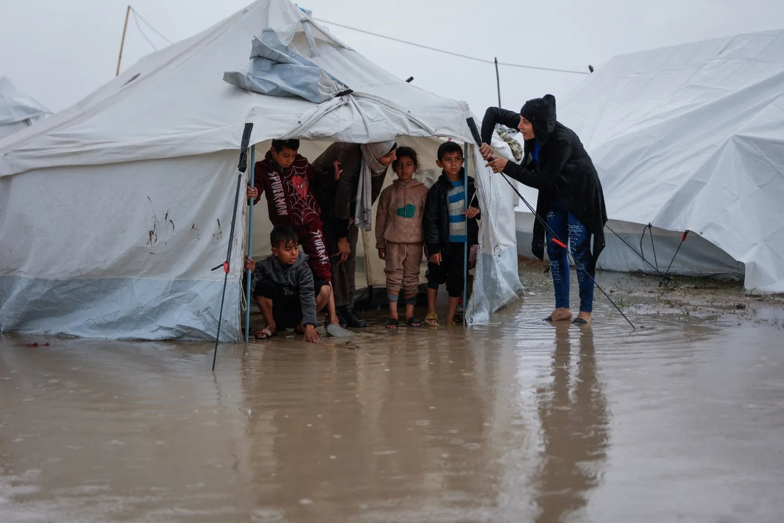 Desperate children in Gaza try to keep floodwater out of tents | Newsfeed