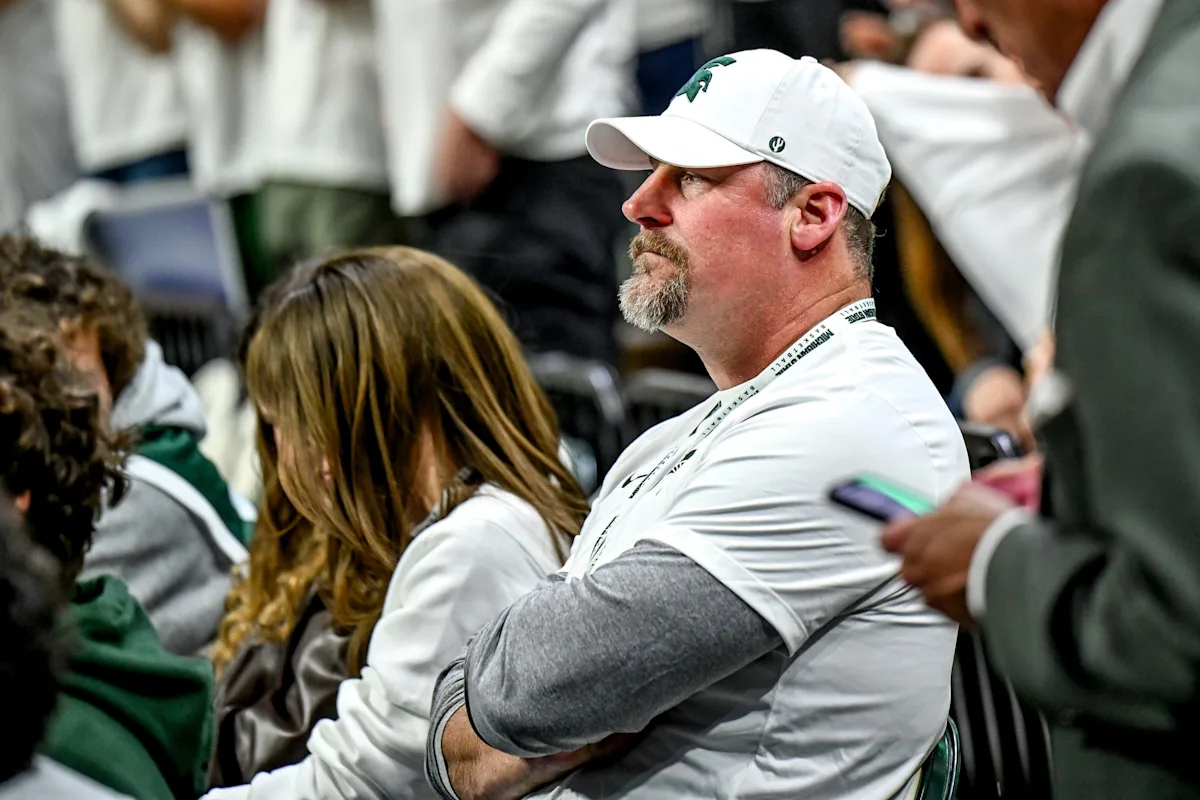 Lions HC Dan Campbell donned the green and white for MSU/UM game