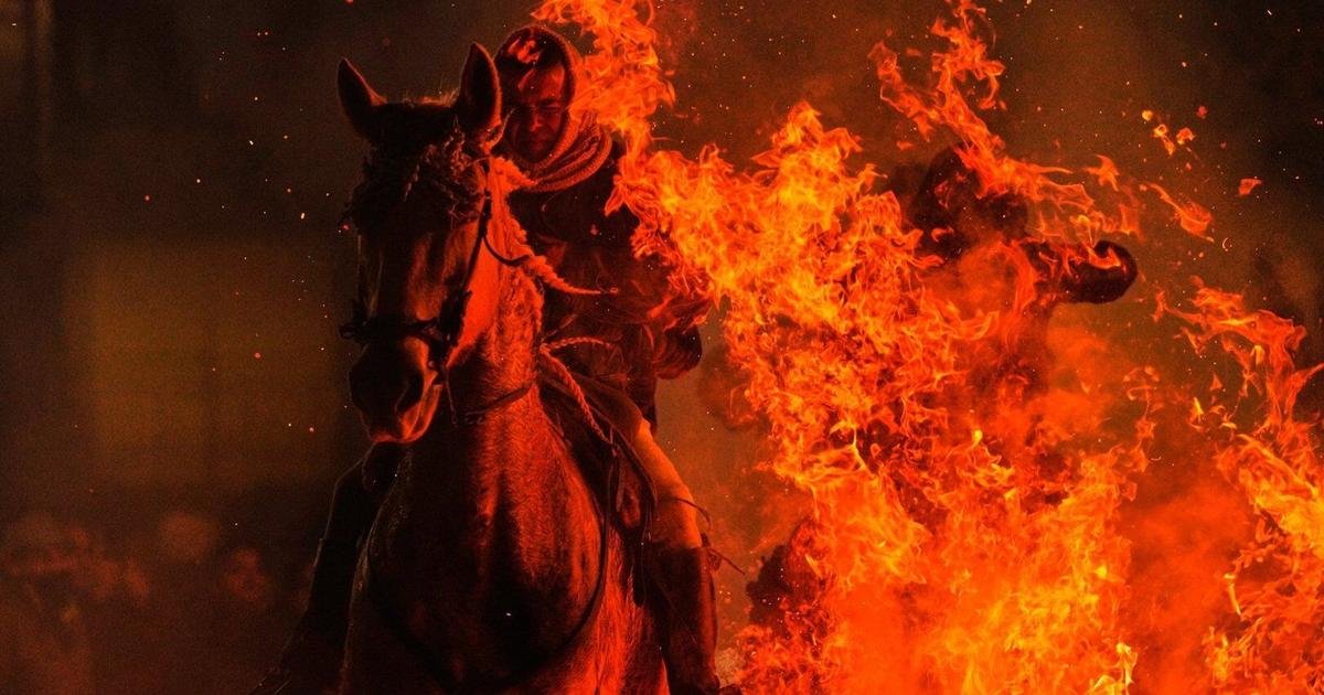 Photos of horses leaping through flames in centuries-old Spanish tradition