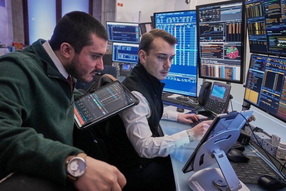 Wall Street opens higher while gold and silver claw back losses