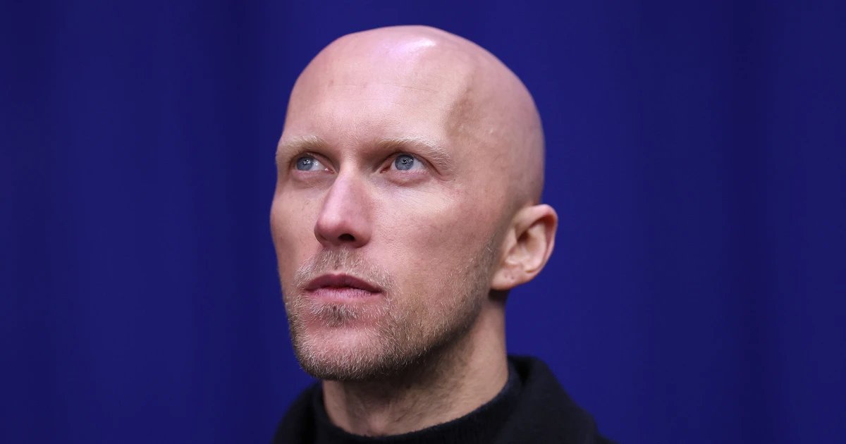 He coaches 16 skaters from 13 countries at the Winter Olympics — with the jackets to prove it