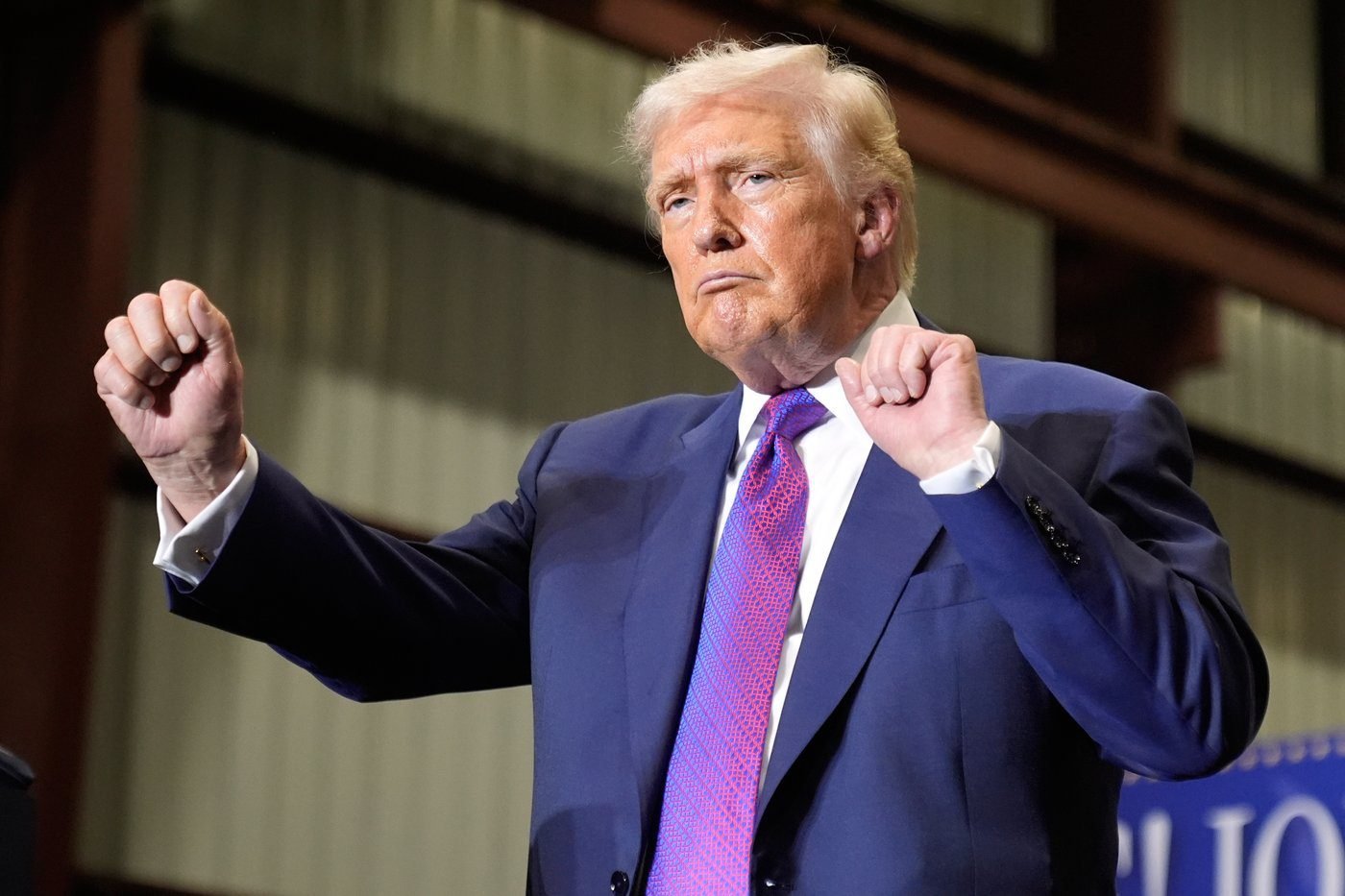 The Latest: Trump’s entourage stocked with people who promoted election loss falsehoods