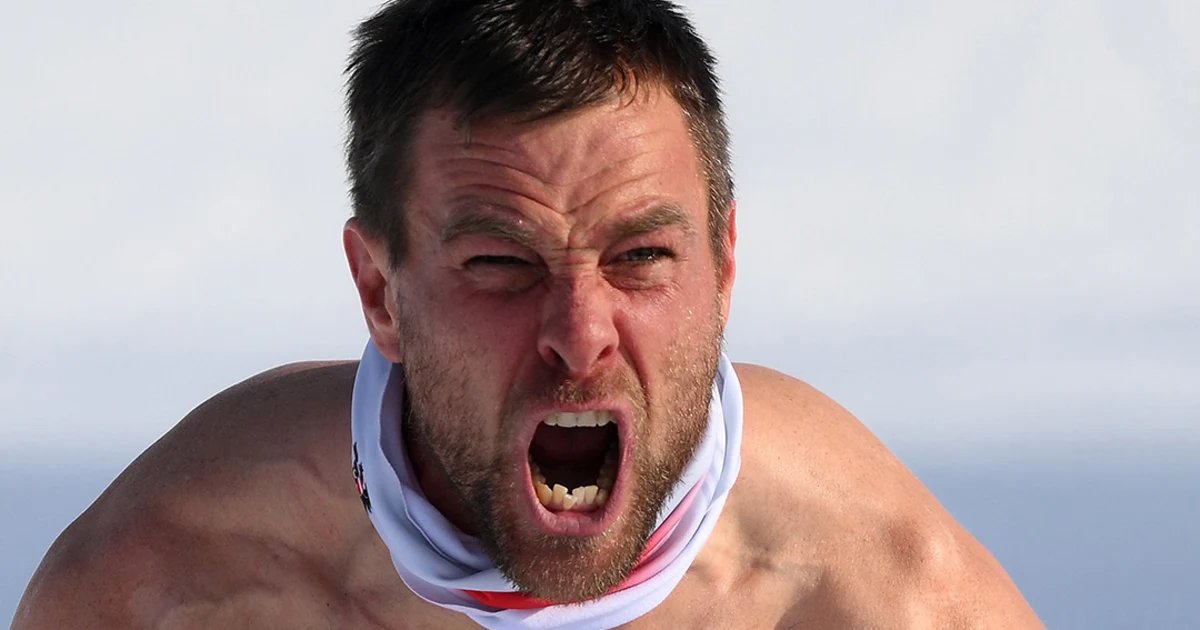 Austria’s Karl celebrates split-second win bare-chested