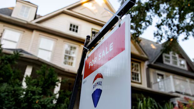 Canada’s benchmark home price fell 4.8% in February compared to last year, says CREA