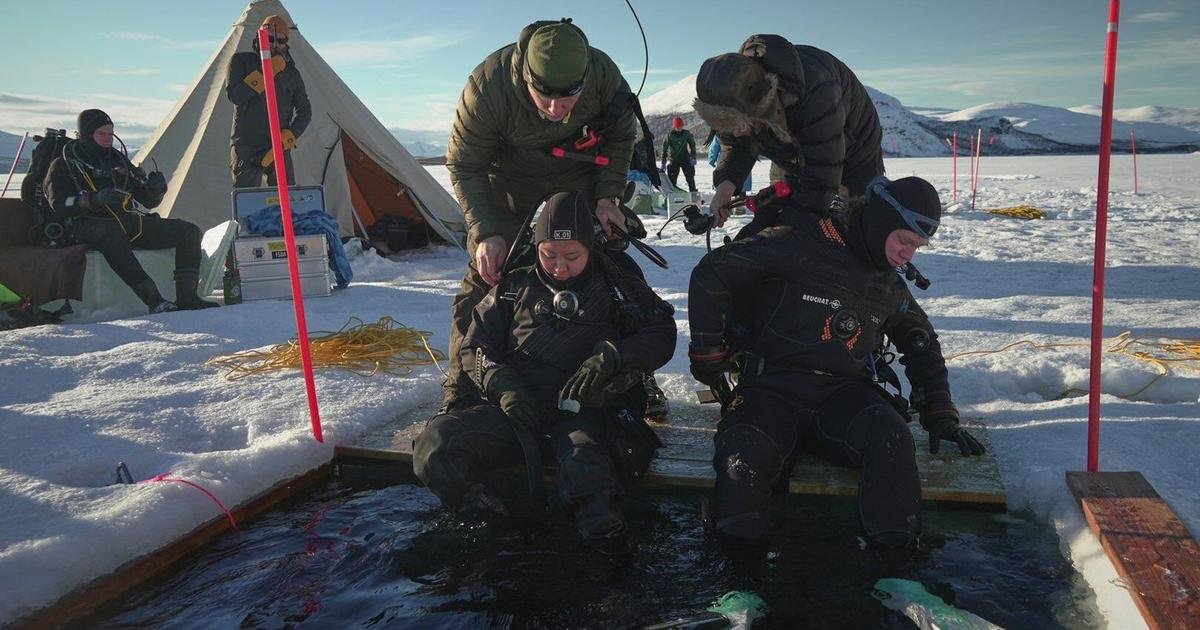 Scientists train to dive beneath polar ice as climate change warms the Arctic and Antarctica