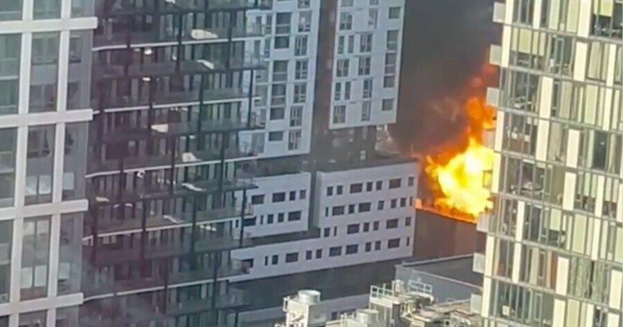 Fire crews battle large blaze with exploding propane cylinders at downtown building just blocks from Rogers Centre