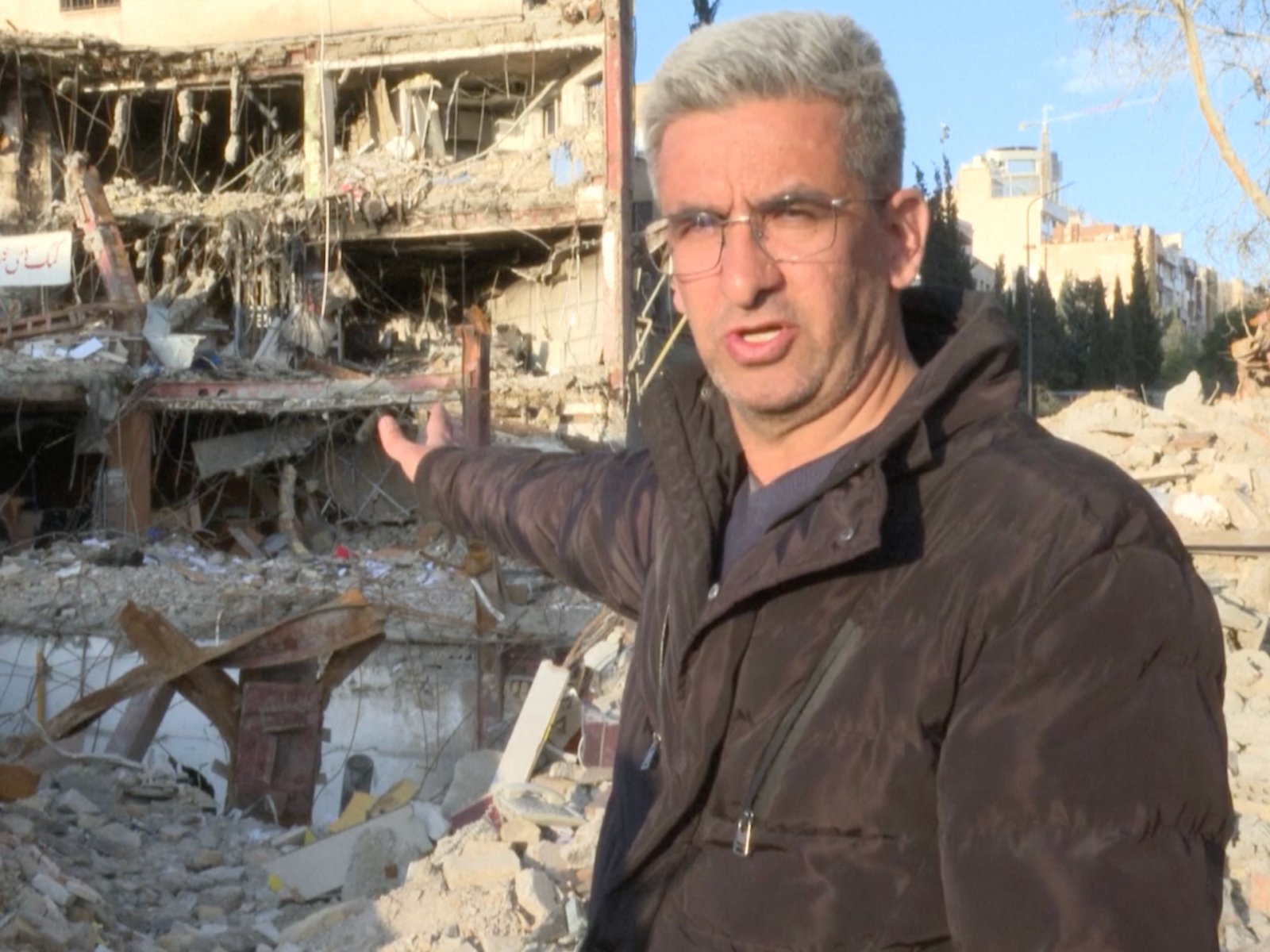 Brothers search rubble for missing sibling under Tehran rubble after strike | US-Israel war on Iran