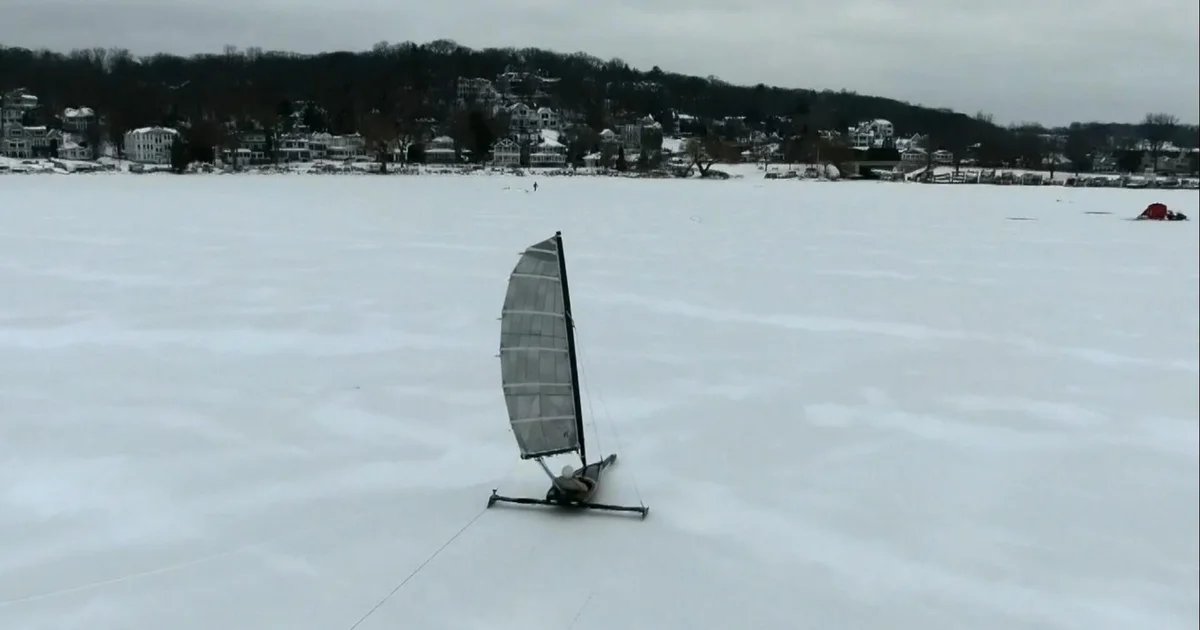 Setting sail on iceboats across a frozen lake in Wisconsin