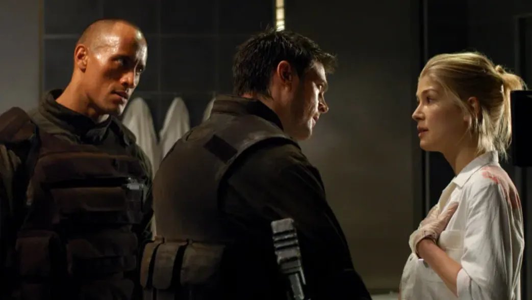 Rosamund Pike Says Her Doom Movie With The Rock Was ‘Probably One of the Worst Films Ever Made’ and ‘Could Have Ended My Career’