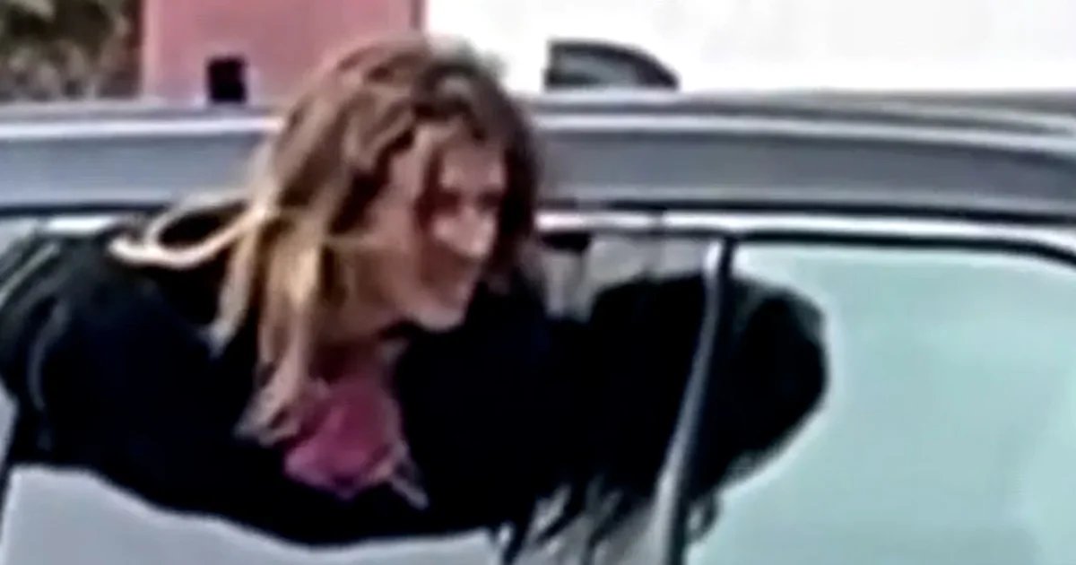 Video shows Michigan woman escaping through cop car window