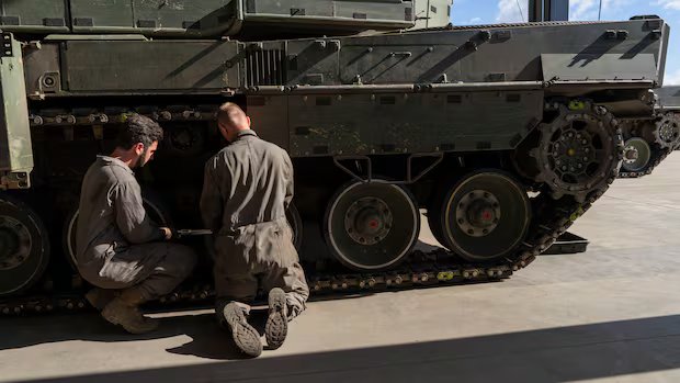 Senior Canadian commander charged by military police in compensation probe