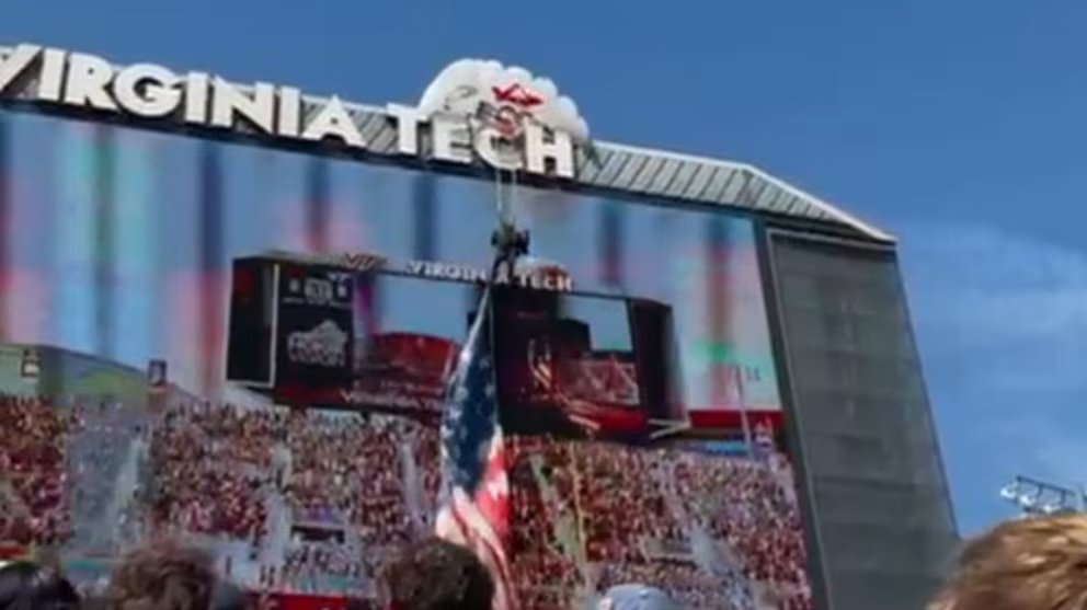 WATCH:  Skydiver slams into Virginia Tech scoreboard, dangles by parachute