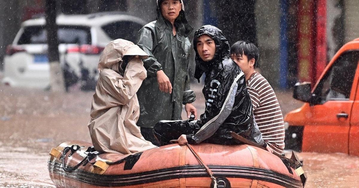 Heavy flooding in southern China forces evacuations and leaves vehicles submerged