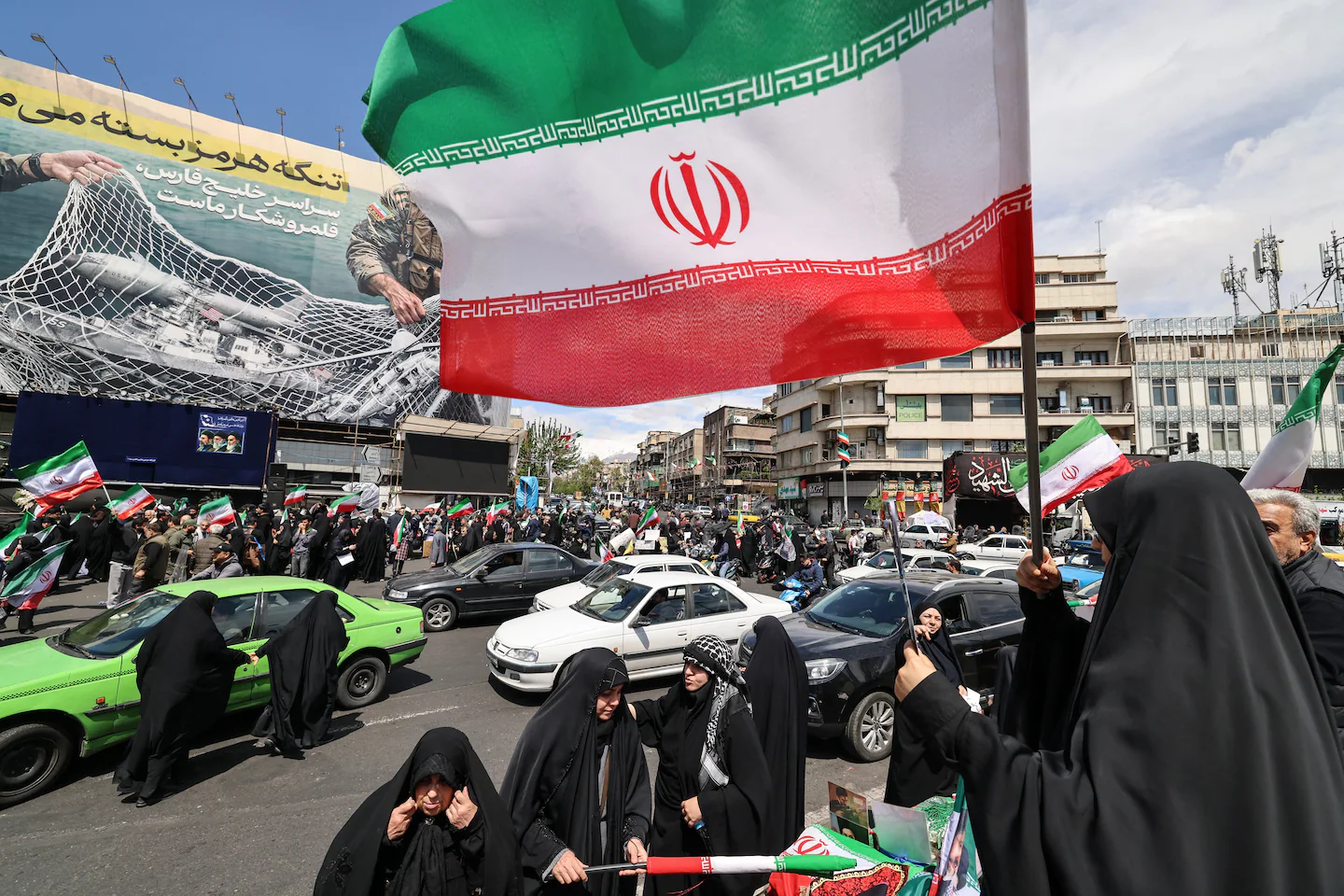 After Trump pauses war, Iranians fly flags of victory not surrender