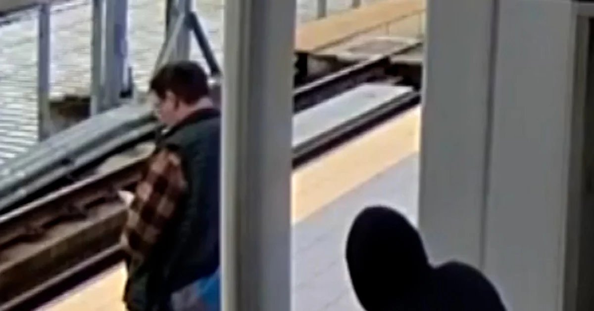 Suspect appears to push man into oncoming train path