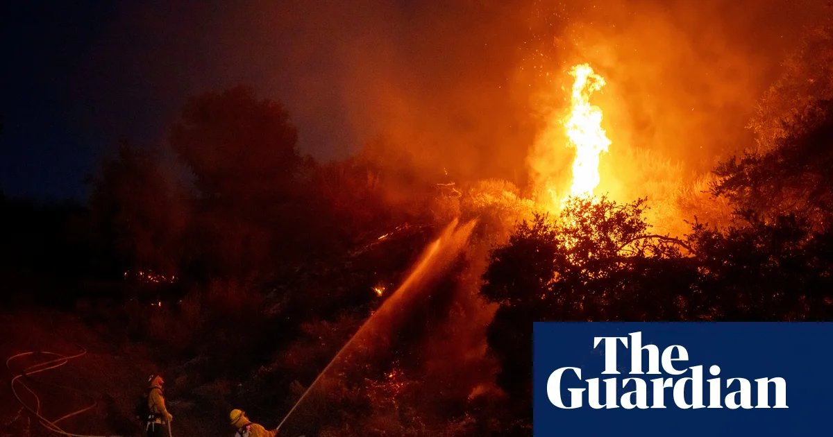 Thousands under evacuation orders in southern California as wildfire threatens homes | California