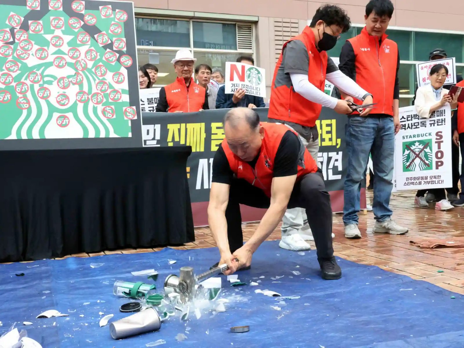 South Korean activists smash Starbucks cups to protest ‘Tank Day’ campaign | News