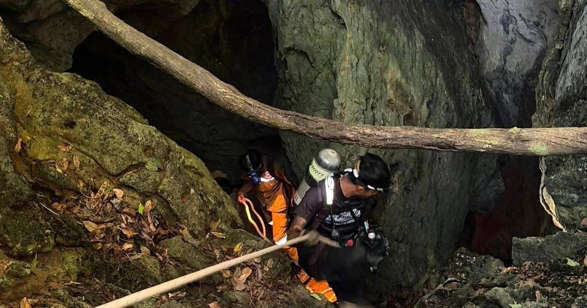 Heavy rains threaten to delay search for 2 people missing in Laos cave