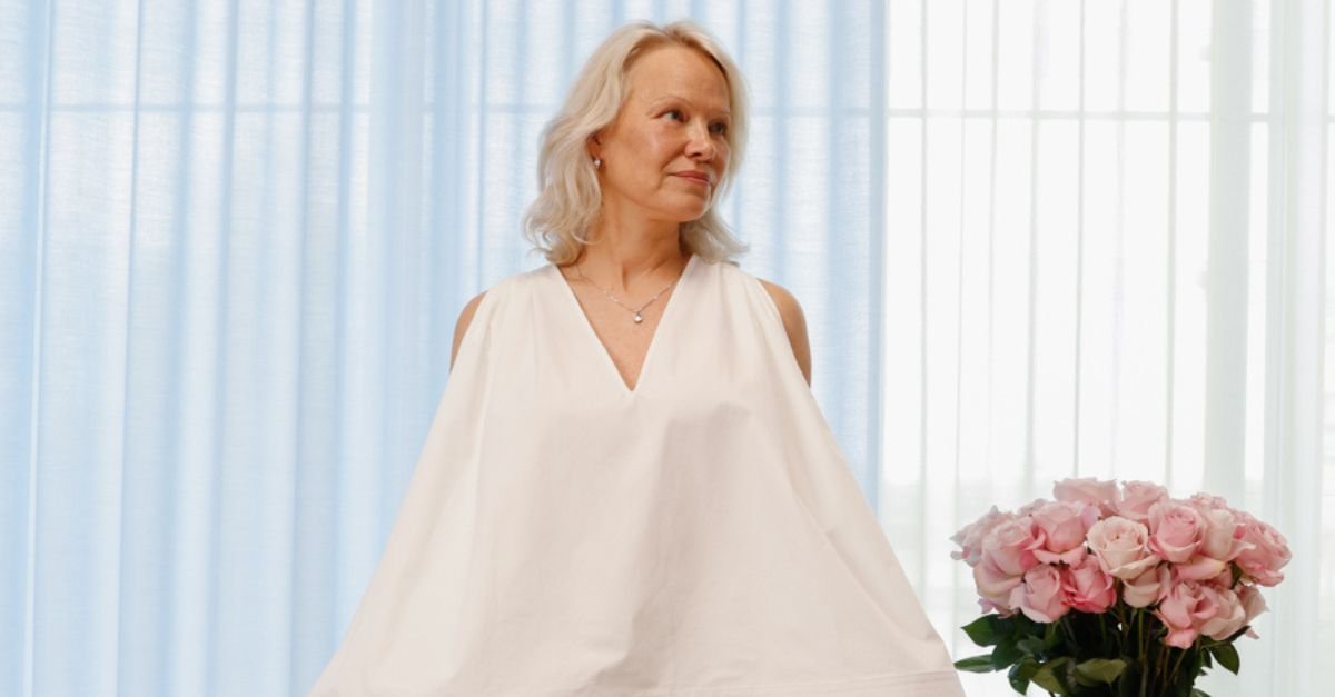 Pamela Anderson Just Styled a White Cotton Blouse in the Chicest Way