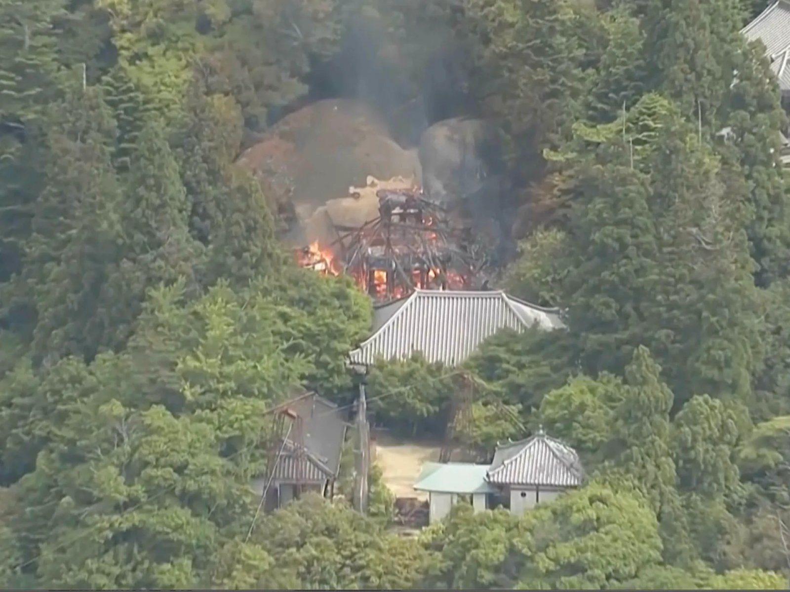 Buddhist hall housing ‘eternal flame’ burns down in Japan | News