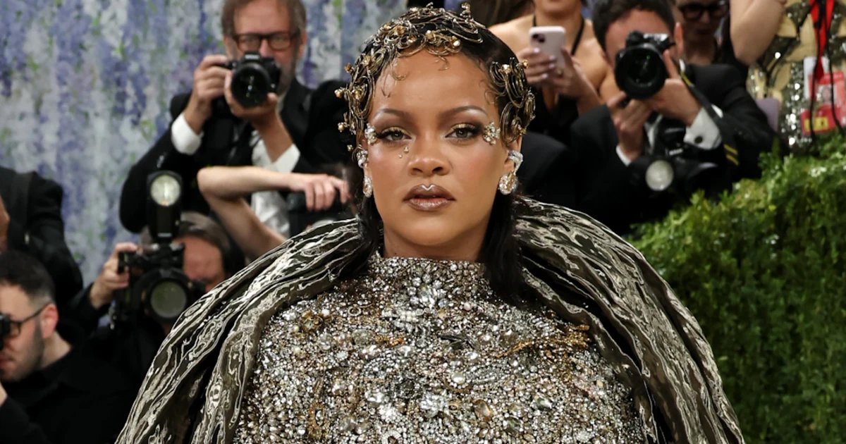 Rihanna stuns in gold dress with partner A$AP Rocky