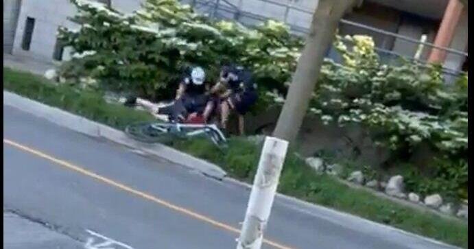 Cyclist caught on video being tackled by police suffered concussion, his lawyer says