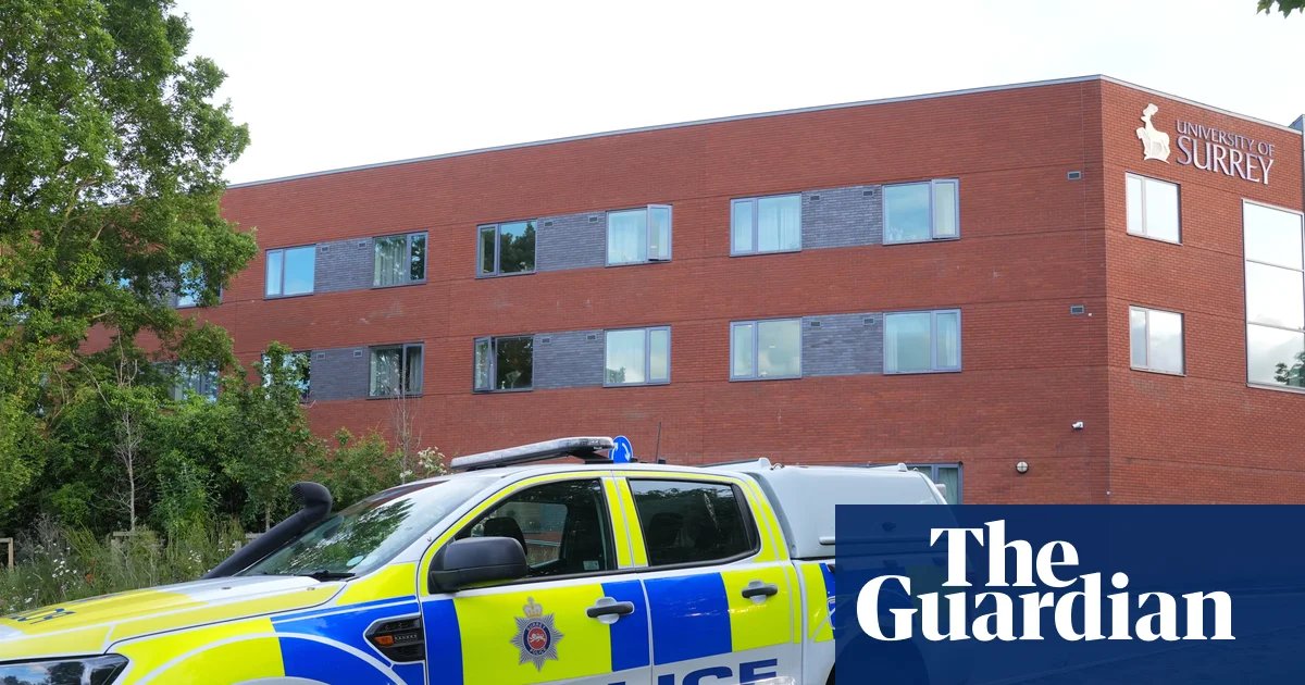 Man, 21, charged with attempted murder after Surrey University staff member shot with crossbow | UK news