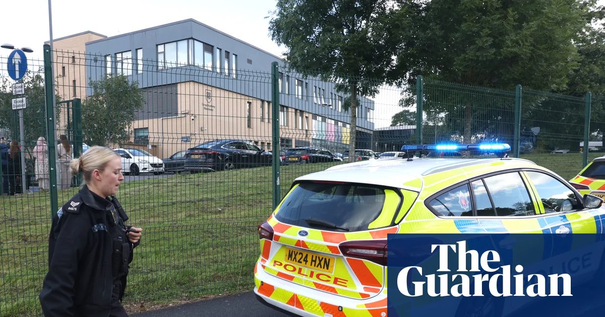 Schoolgirl arrested after three stabbed at Manchester school | UK news