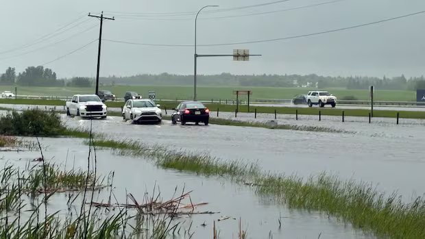 Deluge of rain leads to flooding, water restrictions in Edmonton and area