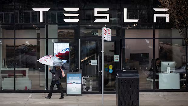 Tesla being investigated after car drives into home, killing 76-year-old woman