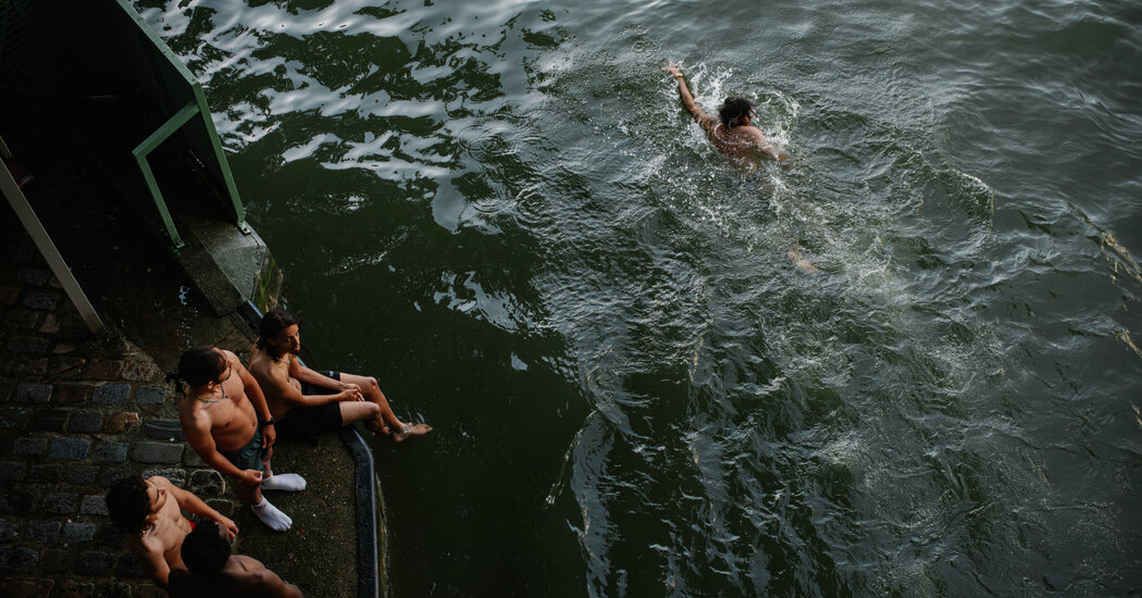 To Escape the Heat, Parisians Jump into an Old Industrial Canal