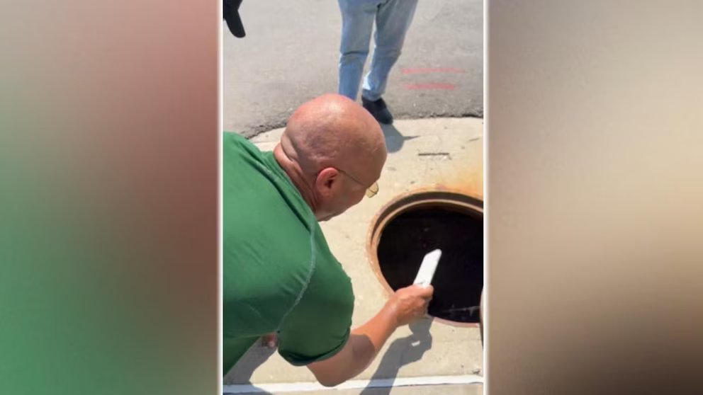 WATCH:  Dad's sewer rescue mission for daughter's phone goes viral