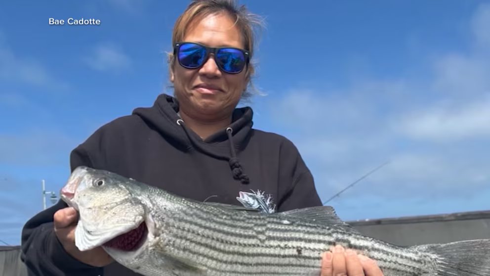 WATCH: Woman survives being pulled into ocean by 'sneaker wave'