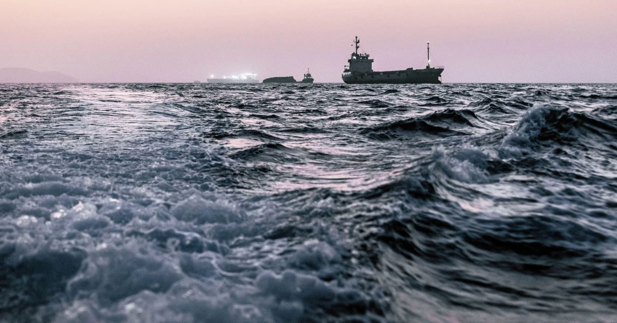 Oil tankers pass the Strait of Hormuz despite Iran threats as traffic slowly picks up and oil prices fall