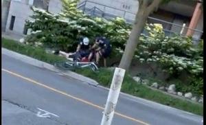 Video shows Toronto police officers tackling cyclist during 'stop-sign enforcement' downtown