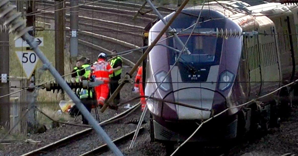 UK police probe cause of train collision that killed driver and left 9 in critical condition