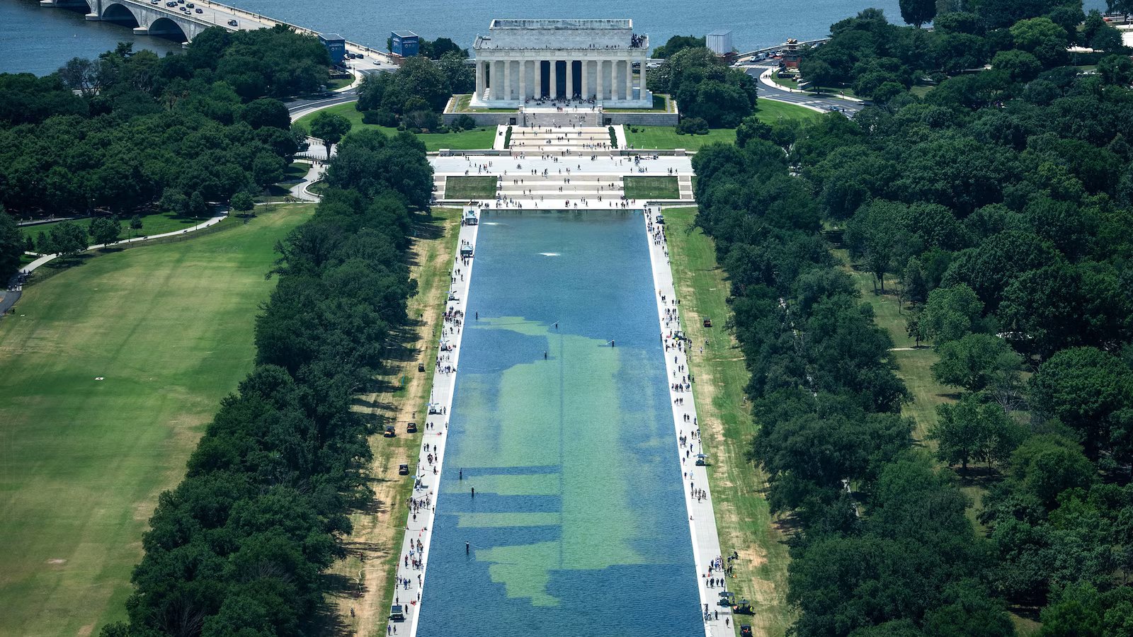 Algae-marred Reflecting Pool draws tourists, but not for reasons Trump wanted