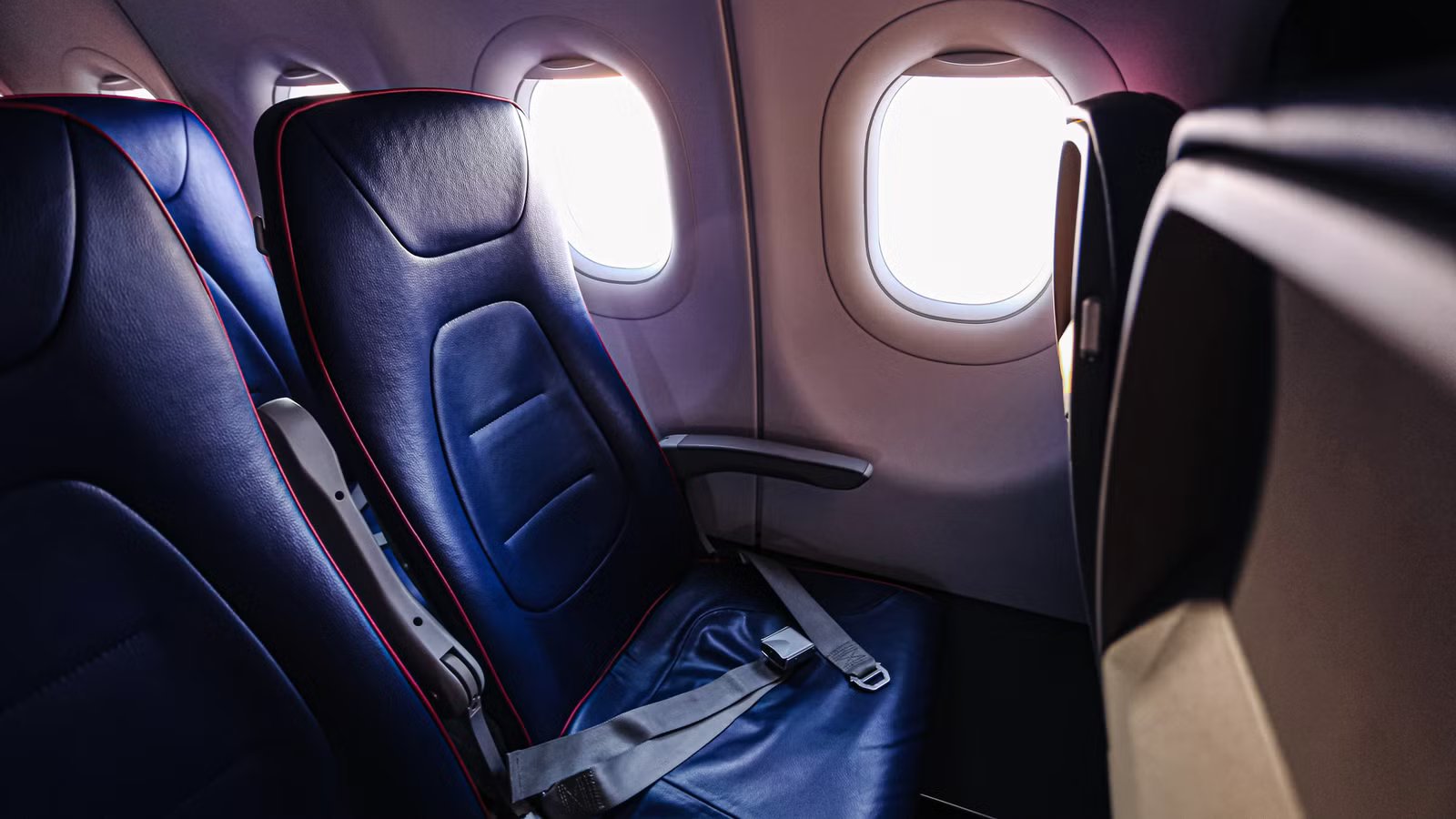 The Armrest Trick Flight Attendants Use & The Safety Rule Behind It