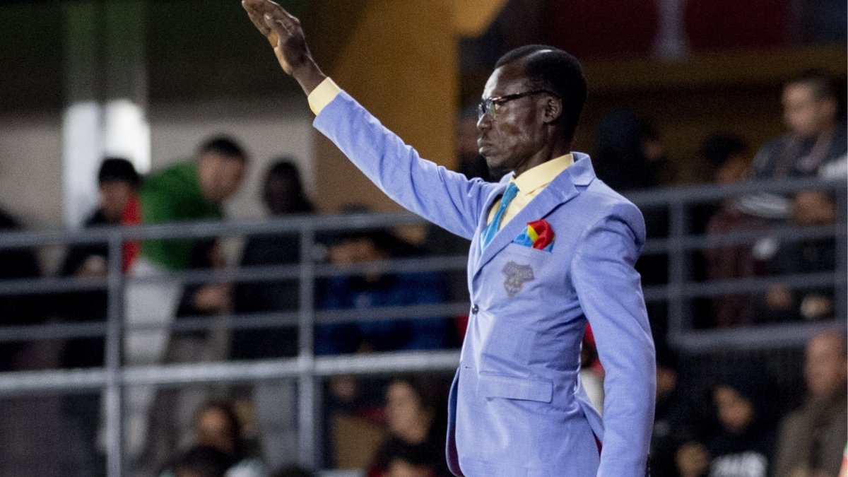 Who is DR Congo’s famous fan and why does he stand for every game?