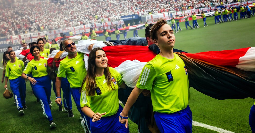 It Takes Coordination (and Many Arms) to Unfurl a World Cup Flag