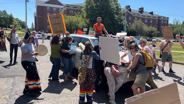 Protesters surround Tim Houston’s car, windshield smashed after speech