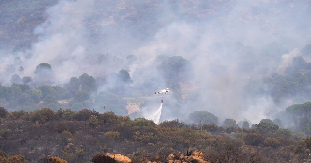Hundreds of Thousands Flee as Fires Rage in Spain and France