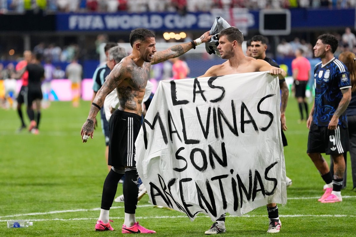 Argentina players celebrate beating England with ‘Falklands are Argentinian’ banner