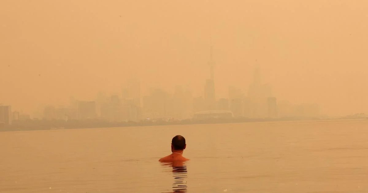 Toronto turns orange under a sky choked by Ontario wildfire smoke: ‘Is this the apocalypse?’